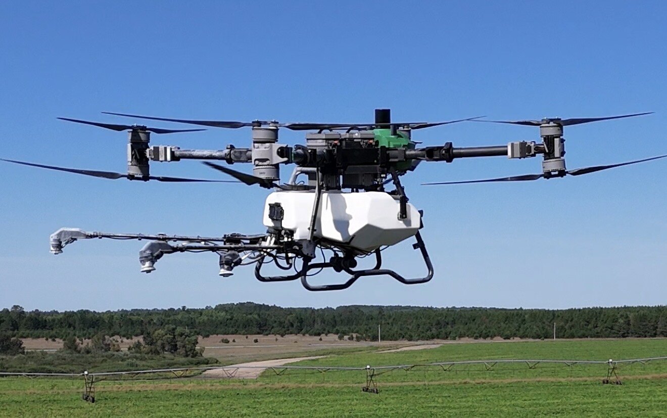 Revolution R-40 agricultural drone flying over a crop field