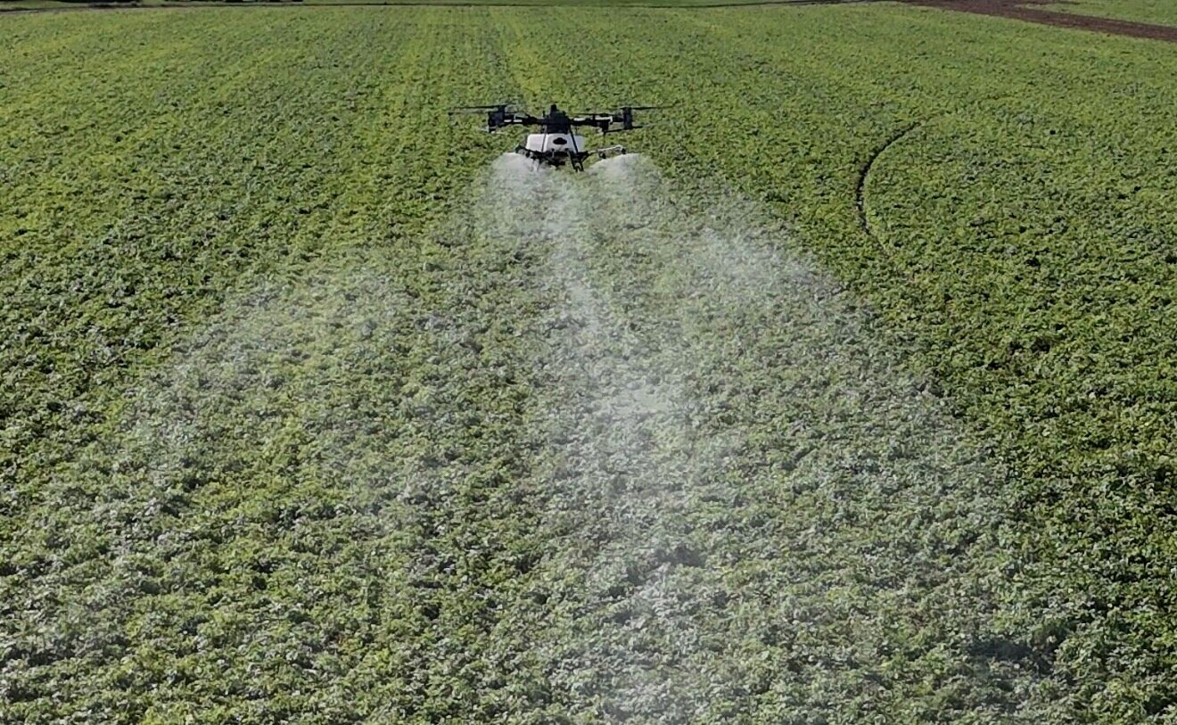 Revolution R-40 applying product across a crop field